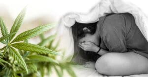 Lady suffering from anxiety crying and covering her face with her hands Could Cannabinoids Cure Chronic Anxiety?